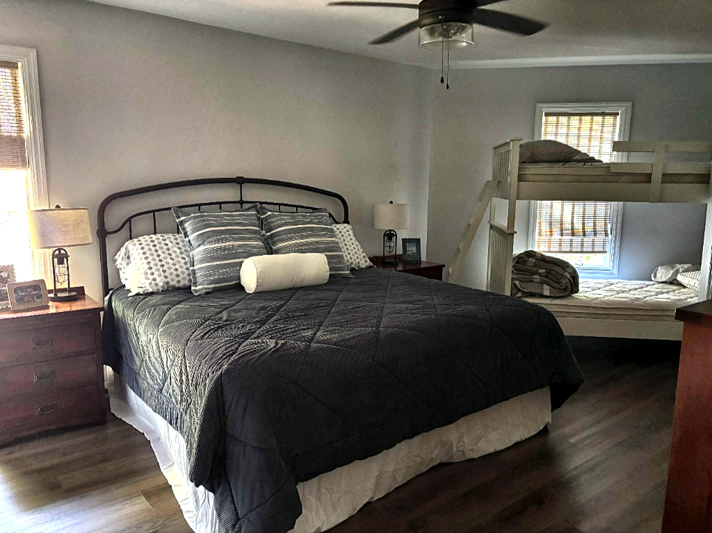 Guest room with king bed and bunk beds